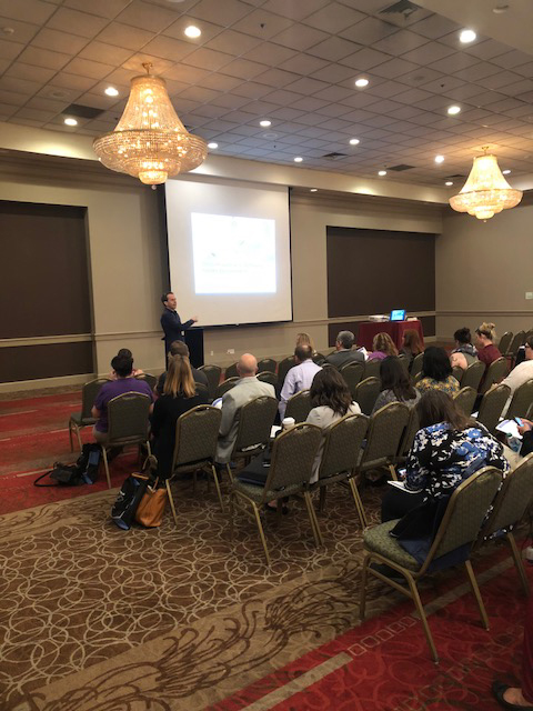 Man presenting at conference